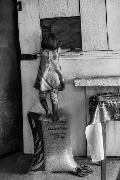 Girl on corn sack