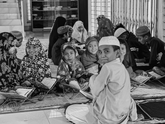 Little Religion Teacher teaching his Little student in Asia