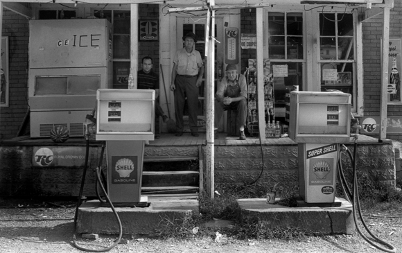 Men on Gas Station Porch 1973
