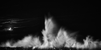 A wave at night