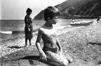 Boy and Pebbles on Beach