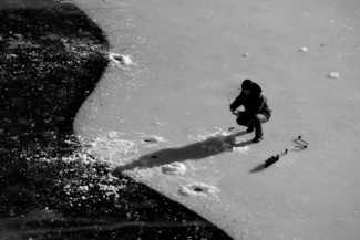 Ice fishing man