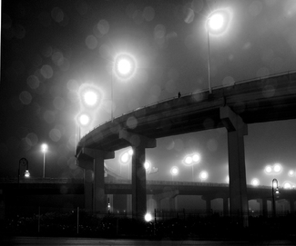 Jack Clark Lone walker in the rain and fog Jack Clark Lone walker in the rain and fog