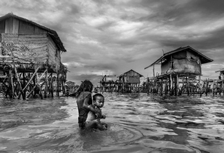 Carrying Her Brother Carrying Her Brother