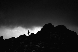 Boy walking on ridge Boy walking on ridge