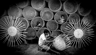 Crafting a basket out of bamboo strips Crafting a basket out of bamboo strips