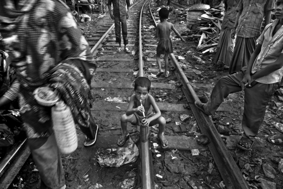 Child Labor - Living by the Railroad Track