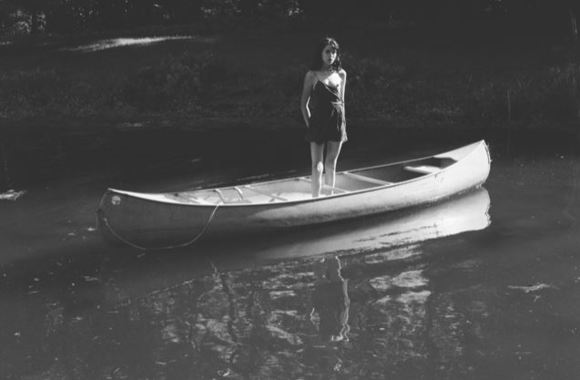 Standing in Canoe
