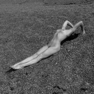 Nude On Pebbled Beach