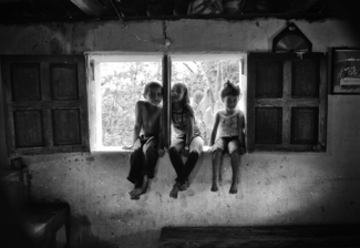 Three Little Children Sat in a Window