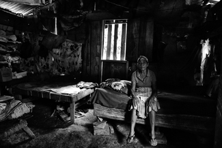 Martiane Sitting on her Bed, The Last Mile, Honduras Martiane Sitting on her Bed, The Last Mile, Honduras