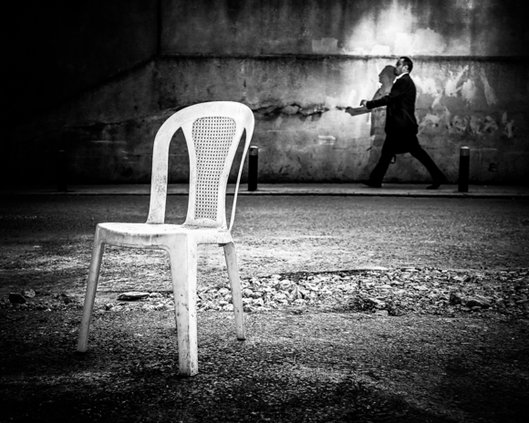 Chair and Man Walking
