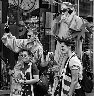 Statues of Liberty With Tourists Statues of Liberty With Tourists