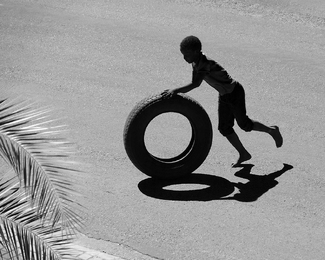 The Boy with the Tyre The Boy with the Tyre
