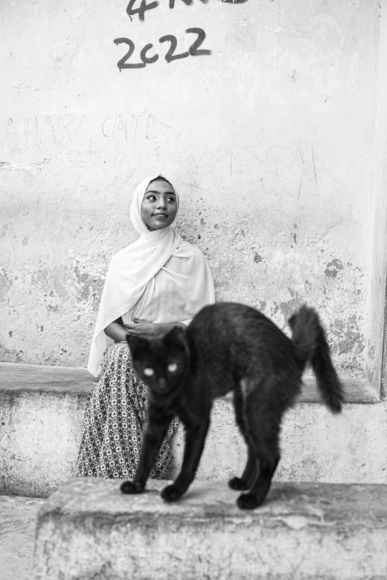 Young Muslim Girl and Her Angry Cat 