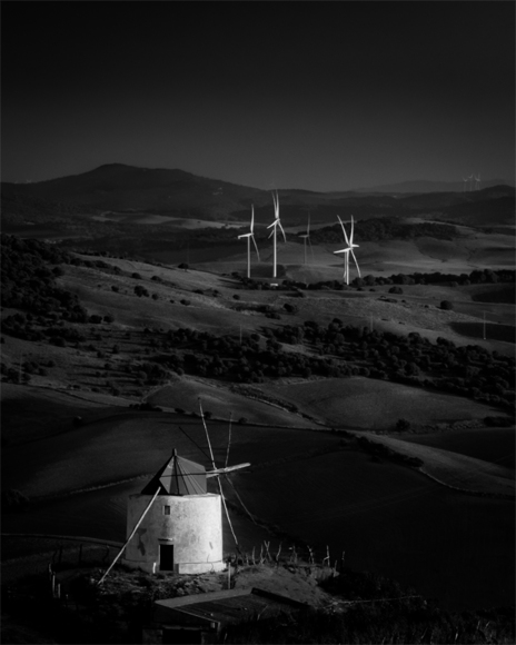 Quixotic old Spanish windmill, sizing up his enemy