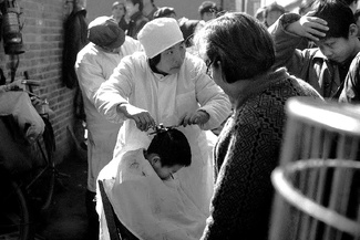 Barber and her clients Barber and her clients