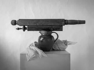 Table legs and a jug of pottery. Table legs and a jug of pottery.
