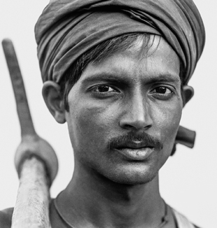 Worker with Pickaxe, Delhi, India Worker with Pickaxe, Delhi, India