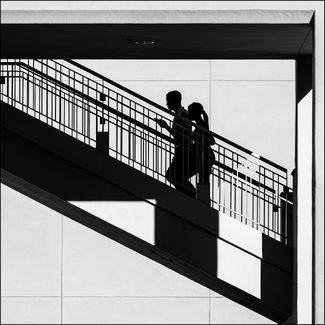 Silhouetted Couple Climbing Stairs Silhouetted Couple Climbing Stairs